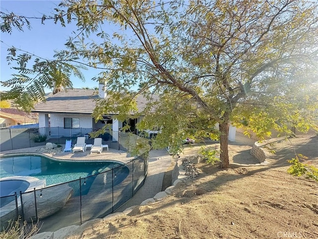 view of pool with a fenced in pool, a patio, and fence