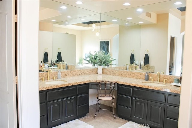 bathroom featuring tile patterned floors, recessed lighting, double vanity, and a sink