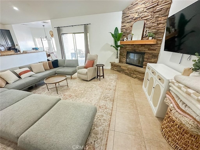 living area featuring light tile patterned floors, recessed lighting, and a fireplace