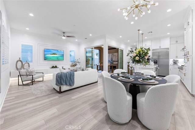 450 Chorus, Irvine, CA 92618 - dining room with recessed lighting, light wood-style flooring, ceiling fan with notable chandelier, and crown molding