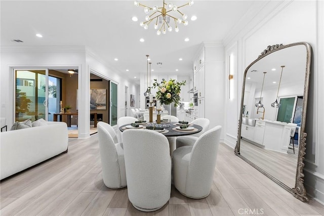 450 Chorus, Irvine, CA 92618 - dining space featuring recessed lighting, light wood-style floors, a chandelier, and ornamental molding
