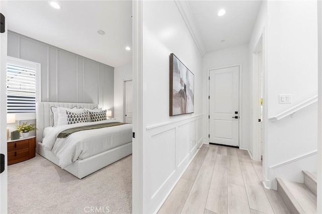 450 Chorus, Irvine, CA 92618 - bedroom with recessed lighting, light wood finished floors, and a decorative wall