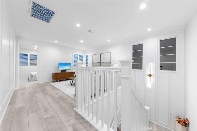 450 Chorus, Irvine, CA 92618 - hall featuring recessed lighting, visible vents, an upstairs landing, and light wood-style floors