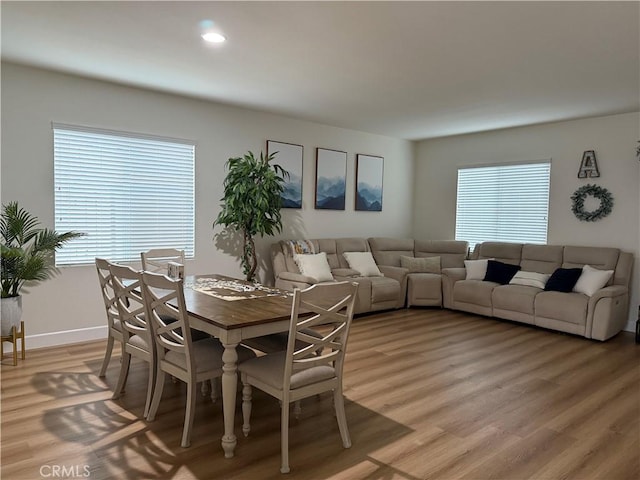 dining space featuring recessed lighting, plenty of natural light, and light wood-style flooring