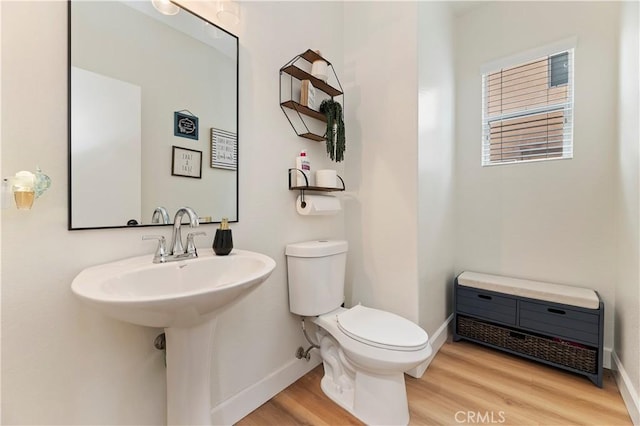 29193 Via Espada, Murrieta, CA 92563 - half bathroom with wood finished floors, toilet, and baseboards