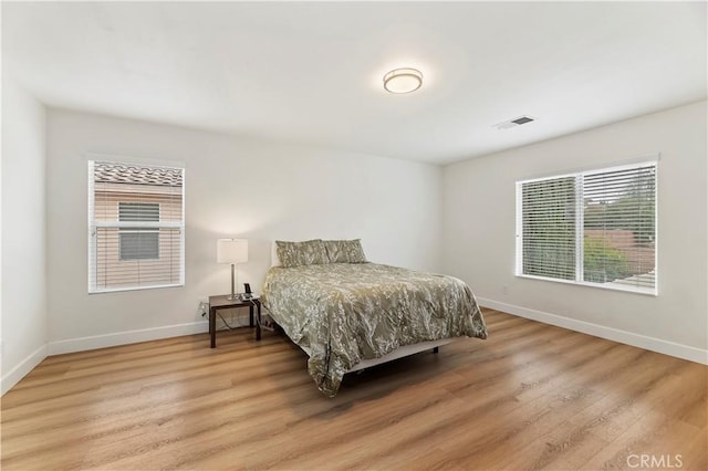 29193 Via Espada, Murrieta, CA 92563 - bedroom with baseboards and light wood-type flooring