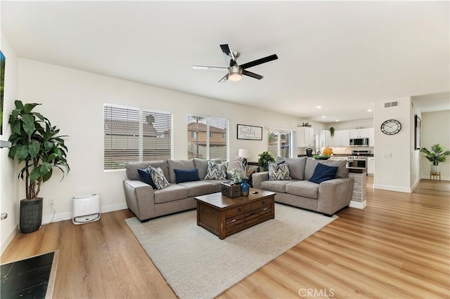 29193 Via Espada, Murrieta, CA 92563 - living area featuring ceiling fan, light wood finished floors, baseboards, and recessed lighting