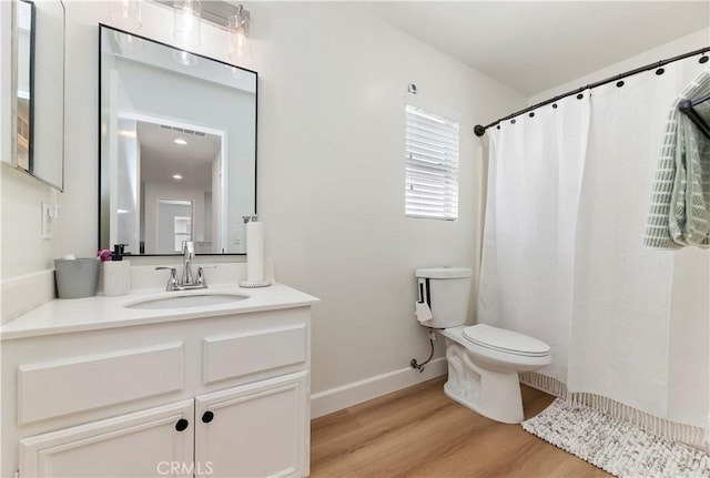 29193 Via Espada, Murrieta, CA 92563 - full bathroom with wood finished floors, vanity, toilet, curtained shower, and baseboards