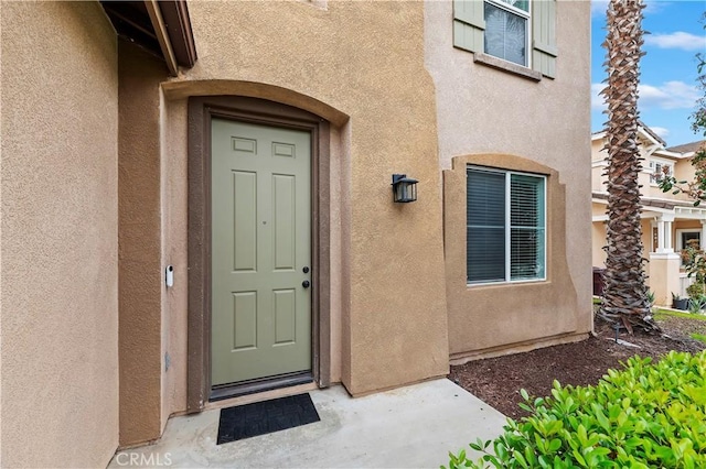 29193 Via Espada, Murrieta, CA 92563 - property entrance with stucco siding