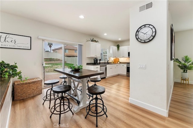 29193 Via Espada, Murrieta, CA 92563 - dining space with light wood-style floors, recessed lighting, and baseboards