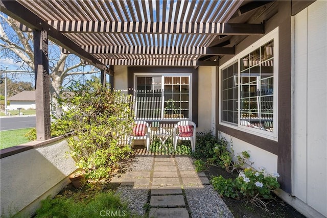 view of patio / terrace with a porch and a pergola