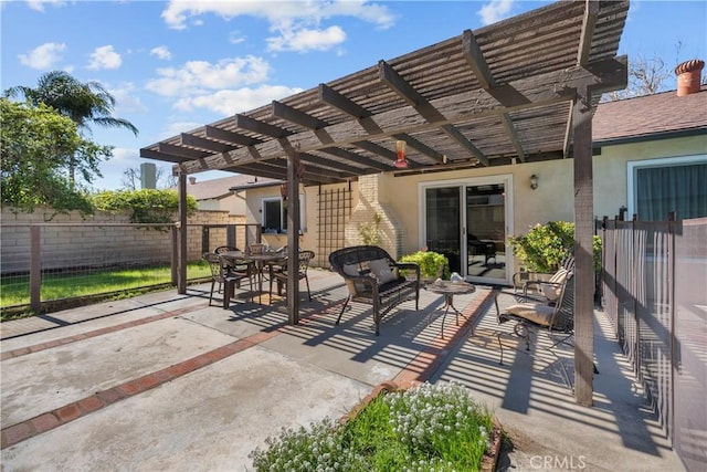 view of patio / terrace featuring a pergola and fence