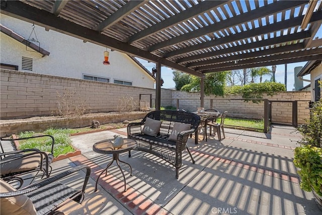 view of patio / terrace with an outdoor living space, a fenced backyard, and a pergola