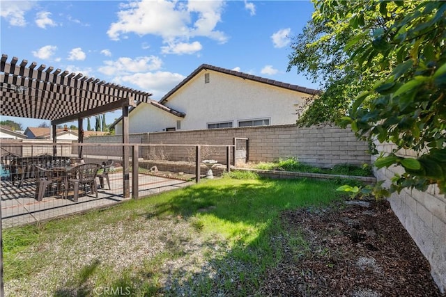 view of yard with a patio area, a pergola, and a fenced backyard