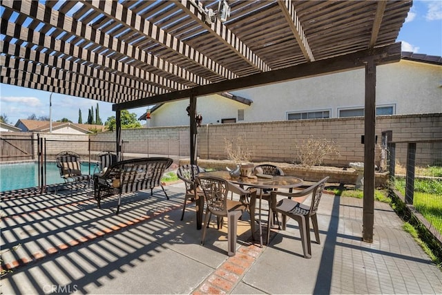 view of patio / terrace featuring outdoor dining space, a fenced in pool, a pergola, and a fenced backyard