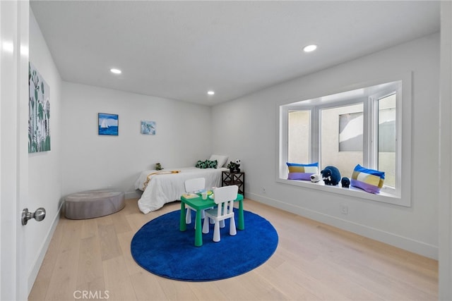 playroom with recessed lighting, wood finished floors, and baseboards