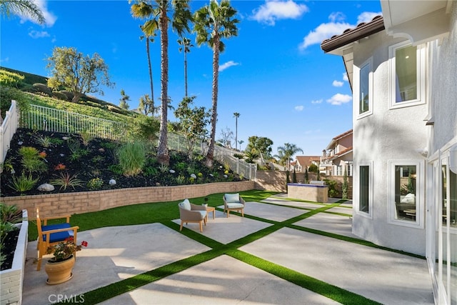 exterior space with a patio and a fenced backyard