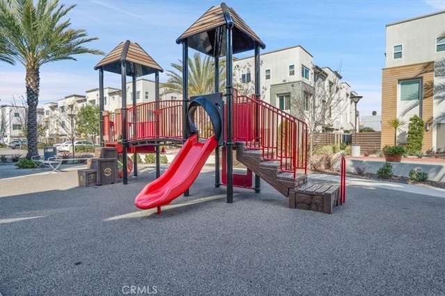 community jungle gym with a residential view