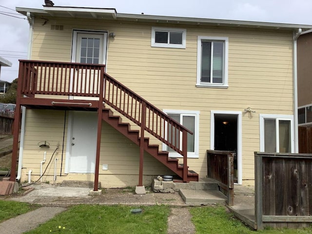 back of house with stairway