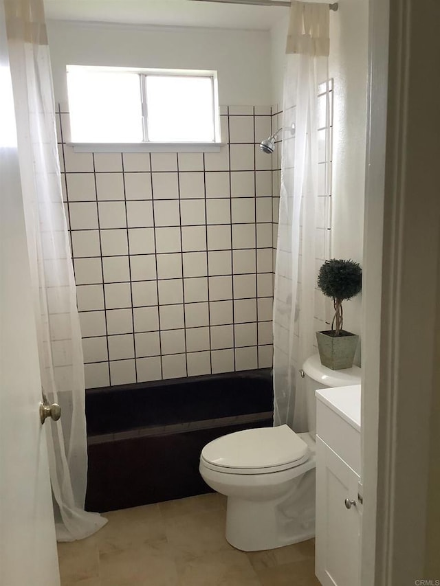 bathroom with vanity, toilet, and shower / bath combo with shower curtain