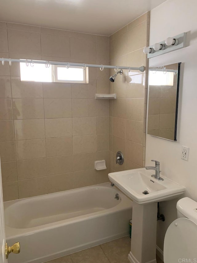 full bath with shower / bath combination, toilet, and tile patterned flooring