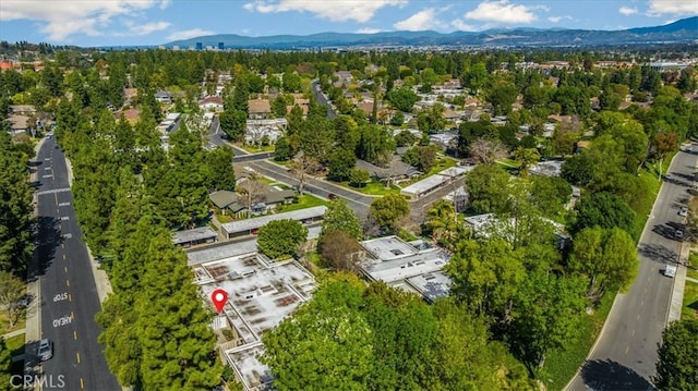 drone / aerial view featuring a mountain view