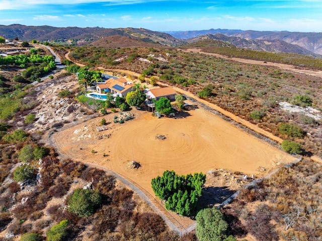 birds eye view of property featuring a mountain view