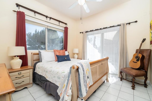 bedroom featuring access to outside, light tile patterned flooring, and ceiling fan