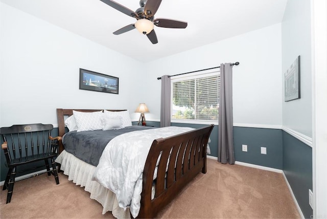 bedroom with baseboards, carpet floors, and a ceiling fan