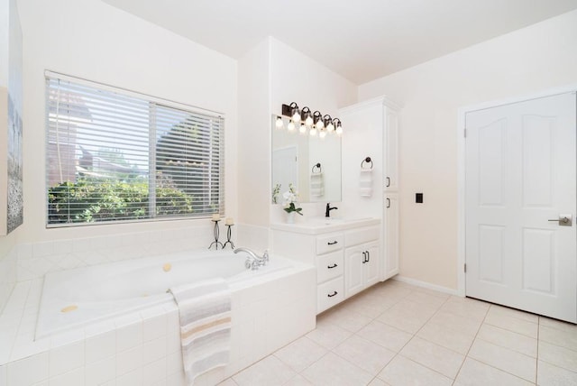 bathroom featuring vanity, a garden tub, and tile patterned floors