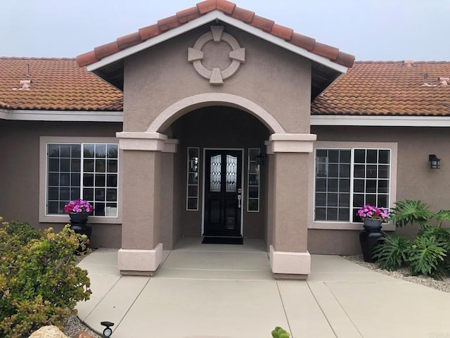 1185 Cedar Summit Dr, Ramona, CA 92065 - view of exterior entry featuring a tile roof and stucco siding