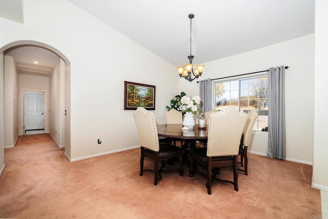 1185 Cedar Summit Dr, Ramona, CA 92065 - dining area with light carpet, a chandelier, arched walkways, and lofted ceiling