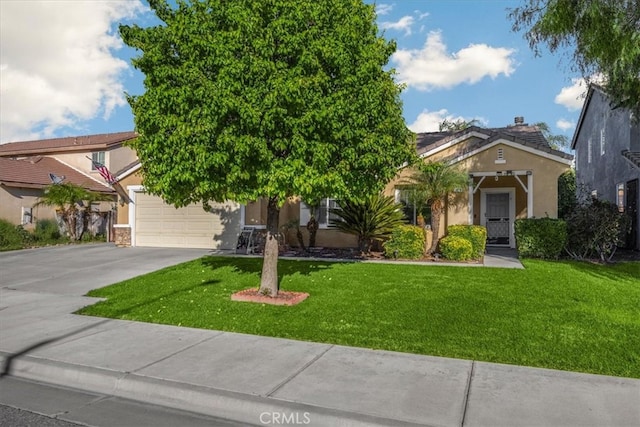 obstructed view of property featuring a front lawn, a garage, driveway, and stucco siding