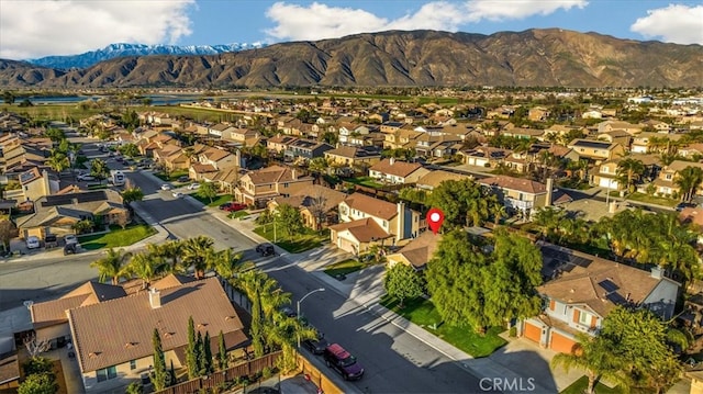 birds eye view of property with a mountain view and a residential view