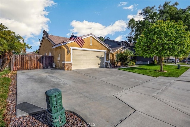 single story home featuring fence, a front yard, stucco siding, driveway, and an attached garage