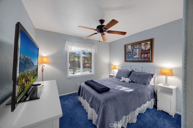 carpeted bedroom with baseboards and ceiling fan