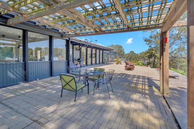 view of patio featuring outdoor dining space and a pergola