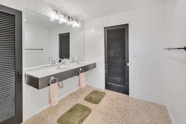 bathroom with double vanity and a sink