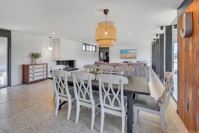 dining room with recessed lighting and light speckled floor