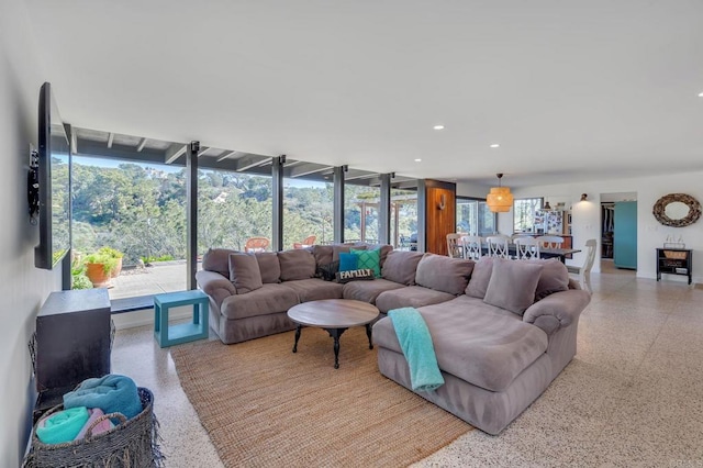 living room featuring recessed lighting and light speckled floor