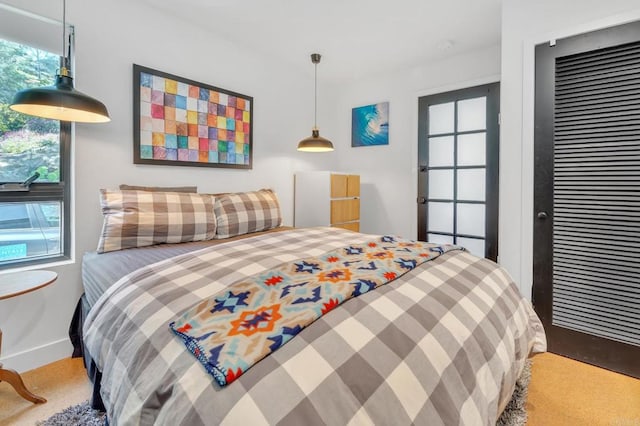 bedroom with a closet and baseboards