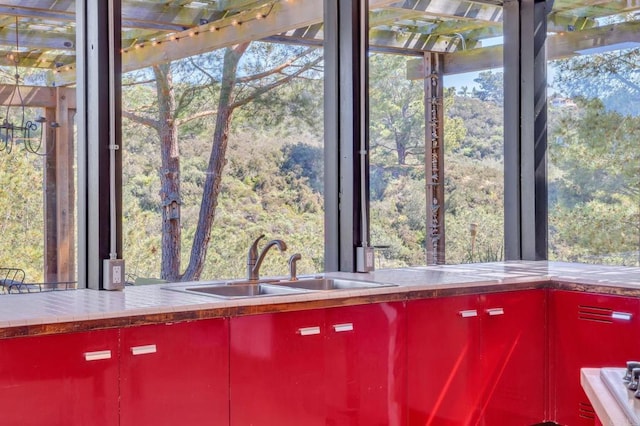 details featuring a sink and a view of trees