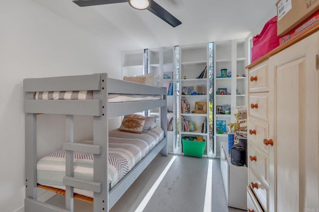 bedroom featuring concrete flooring