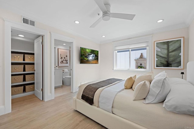 bedroom featuring light wood-style flooring, recessed lighting, visible vents, and ornamental molding