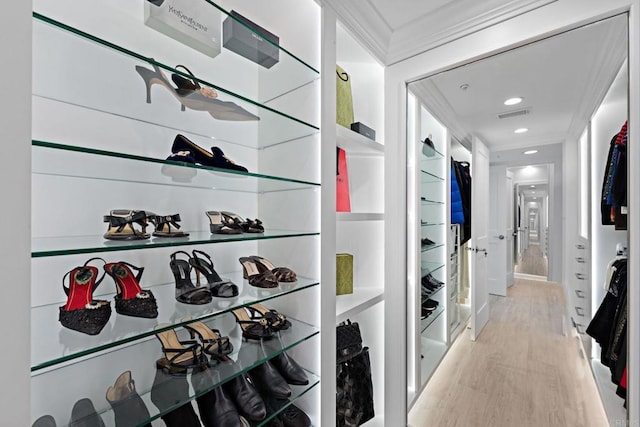 hallway featuring recessed lighting, visible vents, and light wood finished floors