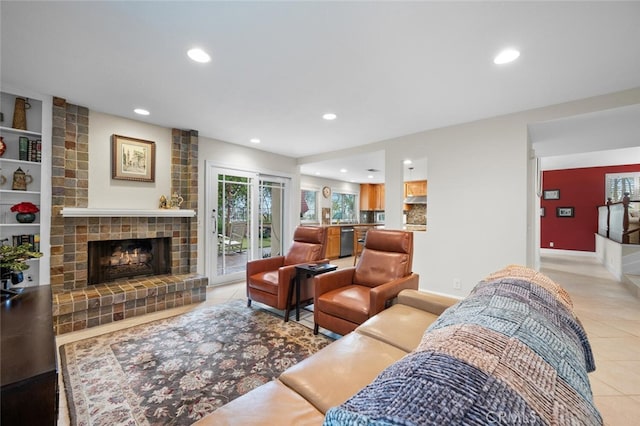 living area with recessed lighting, baseboards, light tile patterned flooring, and a fireplace