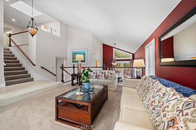 living area with carpet flooring and high vaulted ceiling