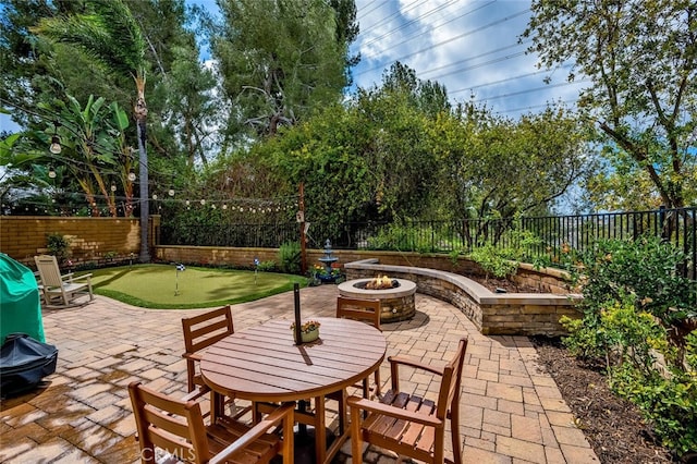 21751 Ontur, Mission Viejo, CA 92692 - view of patio / terrace with a putting green, a fire pit, and a fenced backyard