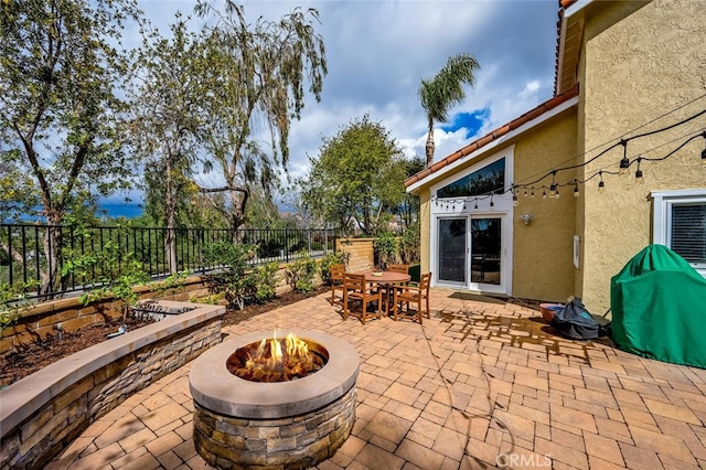 21751 Ontur, Mission Viejo, CA 92692 - view of patio featuring an outdoor fire pit, a fenced backyard, and outdoor dining area