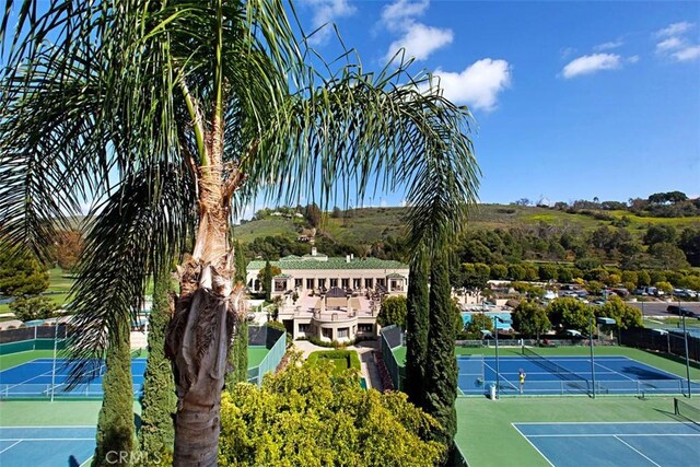 view of sport court with fence